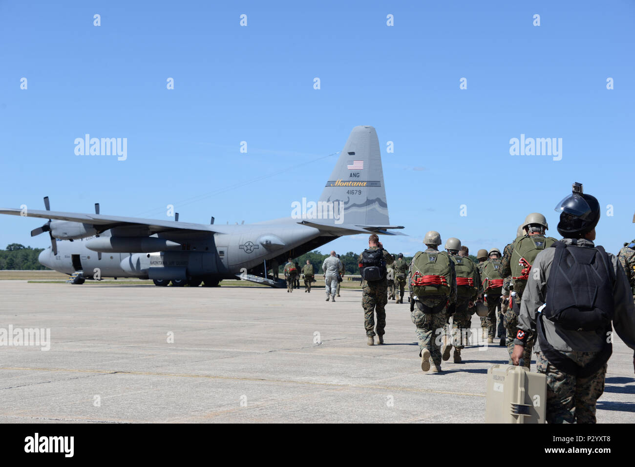 Marines from the 4th Reconnaissance Element out of Fort Sam Houston, Texas, board a C-130 Hercules from the Illinois Air National Guard Aug. 8, 2016, at Grayling Army Airfield, Michigan, as part of Exercise Northern Strike. The exercise brought together multiple branches, states and countries. (U.S. Air Force photo by Senior Airman Amber Carter) Stock Photo