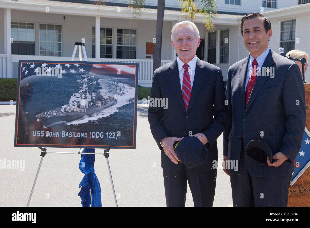 U.S. Secretary of the Navy Mr. Ray E. Mabus (left) and Congressman Darrell Issa (R-CA) (right) pose for a photo after the ship naming ceremony for the USS John Basilone (DDG-122) on Camp Pendleton, Calif., August 16, 2016. (U.S. Marine Corps photo by Cpl. Tyler S. Dietrich) Stock Photo