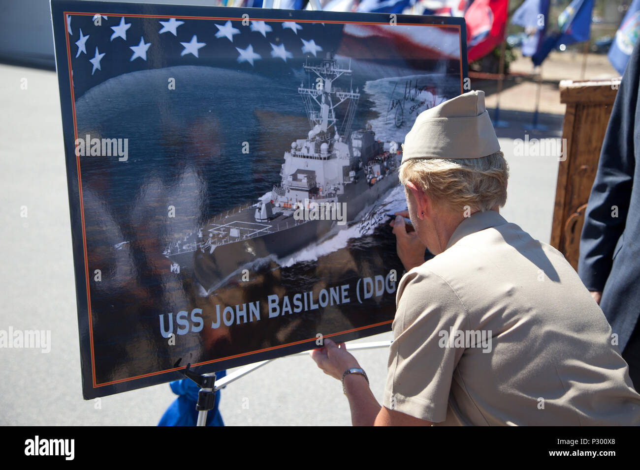 U.S. Navy Vice Adm. Nora W. Tyson, Commander, U.S. 3rd Fleet signs the graphic of the USS John Basilone after the ship naming ceremony for the USS John Basilone (DDG-122) on Camp Pendleton, Calif., August 16, 2016. (U.S. Marine Corps photo by Cpl. Tyler S. Dietrich) Stock Photo