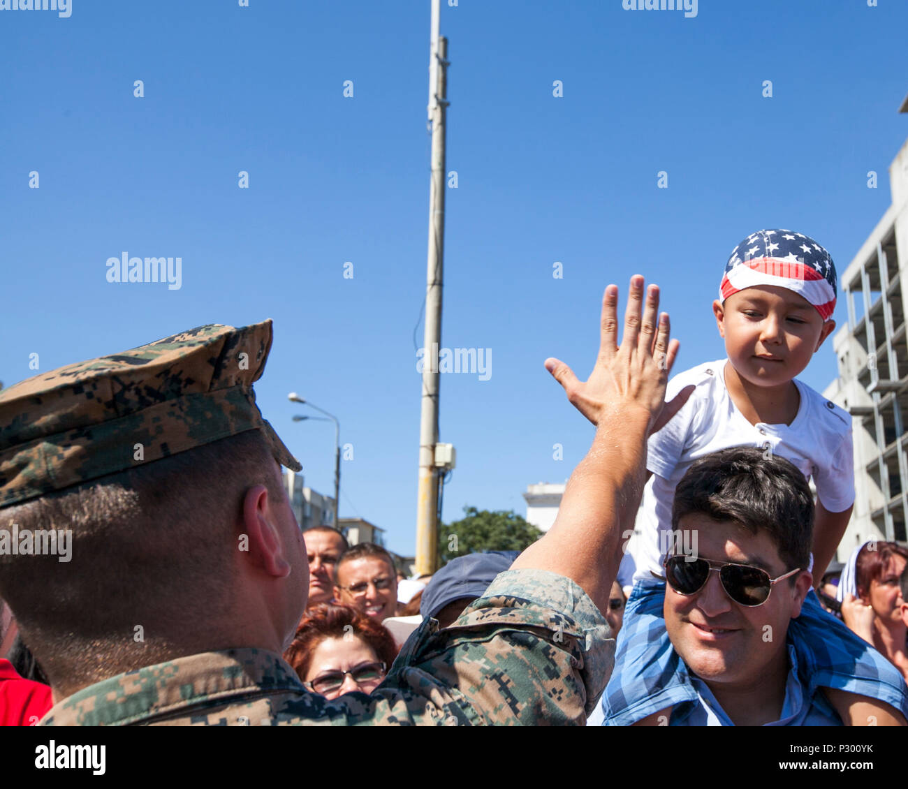 U.S. Marine Corps 1st Lt. Grant Peehler a Civil Affairs Team Leader with the Black Sea Rotational Force, spots an American Flag bandanna during the Romanian Navy Day in Constanța, Romania, Aug. 15, 2016. U.S. Sailors and Marines supporting the Black Sea Rotational Force 16.2 helped pay tribute to the prestigious history of the Romanian navy and highlighted the military’s movement toward new developments and modernizations. Black Sea Rotational Force is an annual multilateral security cooperation activity between the U.S. Marine Corps and partner nations in the Black Sea, Balkan and Caucasus r Stock Photo