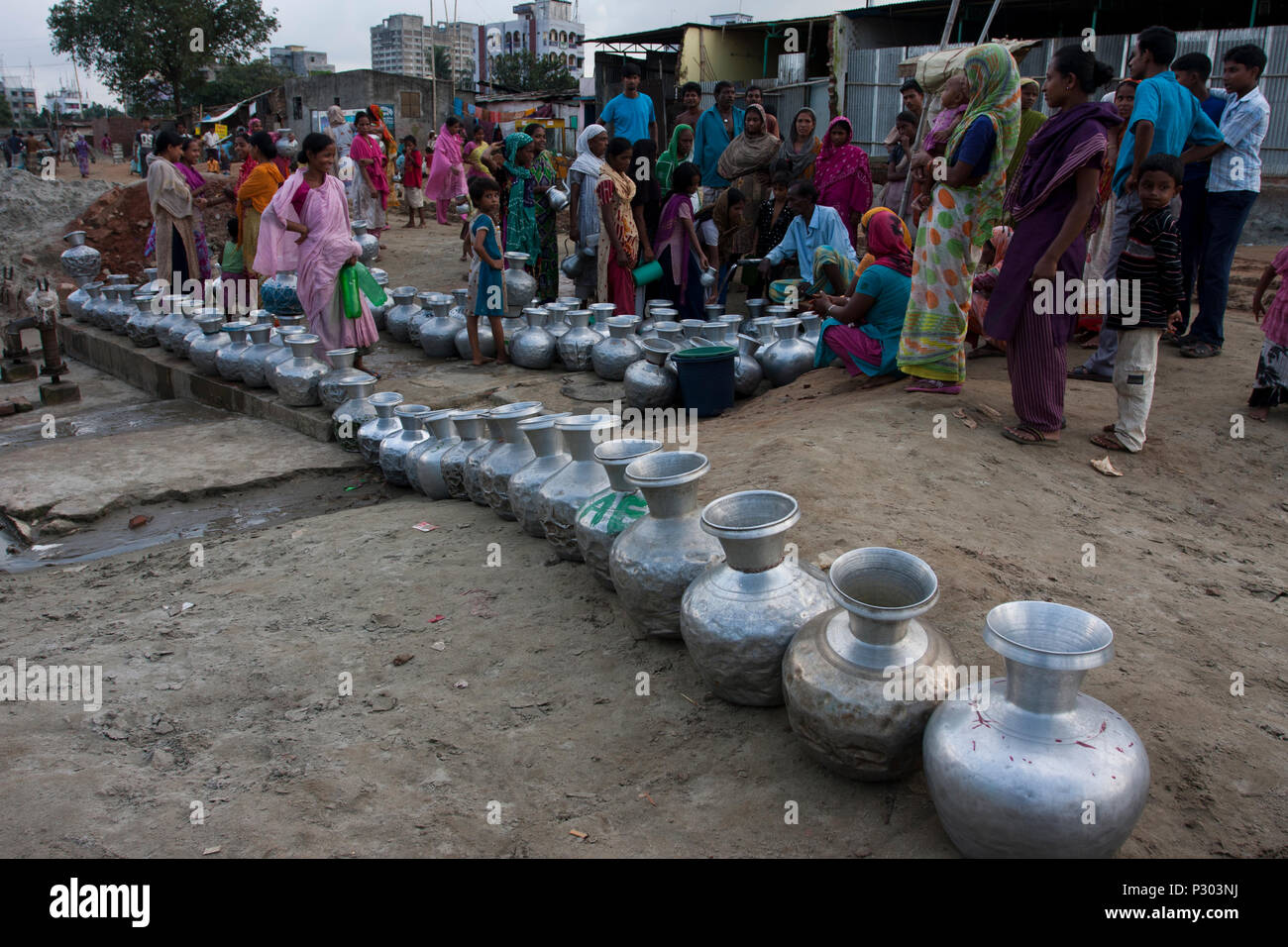 Stranded Pakistanis in Bangladesh of Kurmitola Bihari Camp at Mirpur collect drinking water in a queue. Dhaka, Bangladesh. Stock Photo