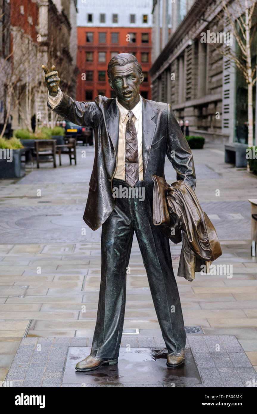 Statue of an office worker hailing a cab near Blackfriars Bridge, off Victoria Embankment. The