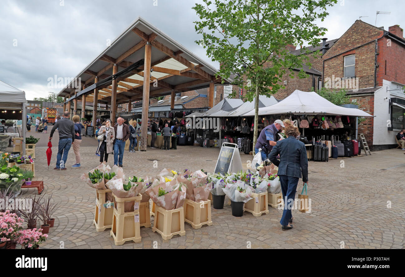 Altrincham Market stalls and shoppers in the regenerated market quarter, Altrincham, Greater Manchester. Stock Photo