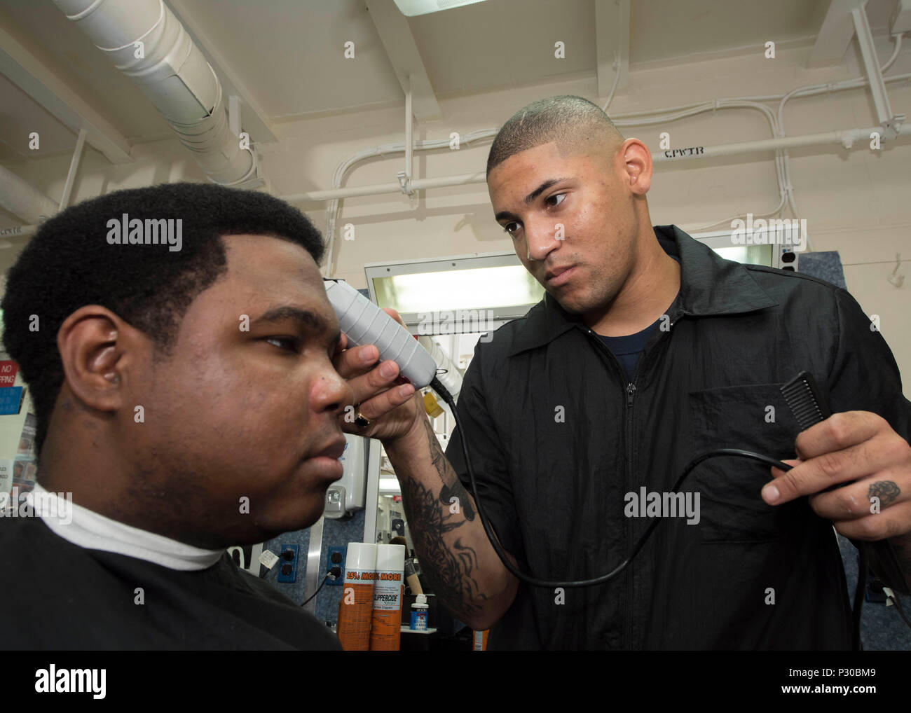 160811-N-NB544-025 EAST CHINA SEA (Aug. 11, 2016) Ship's Serviceman Seaman Benjamin Anguiano, from Fresno, Calif., cuts the hair of Lt. Joseph Green, from Garner, ., aboard amphibious assault ship USS Bonhomme Richard ( 160811-N-NB544-025 EAST CHINA SEA (Aug. 11, 2016) Ship's Serviceman Seaman Benjamin Anguiano, from Fresno, Calif., cuts the hair of Lt. Joseph Green, from Garner, ., aboard amphibious assault ship USS Bonhomme Richard (