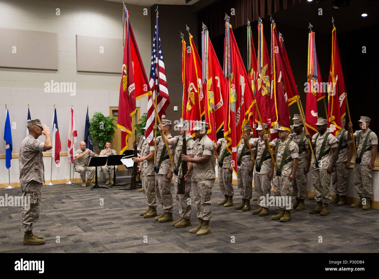 The Force Headquarters Group color guard presents the colors to Lt. Gen. Rex C. McMillian, commander of Marine Forces Reserve and Marine Forces North, during the FHG change of command ceremony at the Federal City Auditorium, New Orleans, Aug. 13, 2016. Each one of the flags represented one of the 12 commands of FHG in honor of the incoming commander Brig. Gen. Michael F. Fahey and outgoing commander Brig. Gen. Helen G. Pratt. (U.S. Marine Corps photo by Lance Cpl. Melissa Martens/ Released) Stock Photo