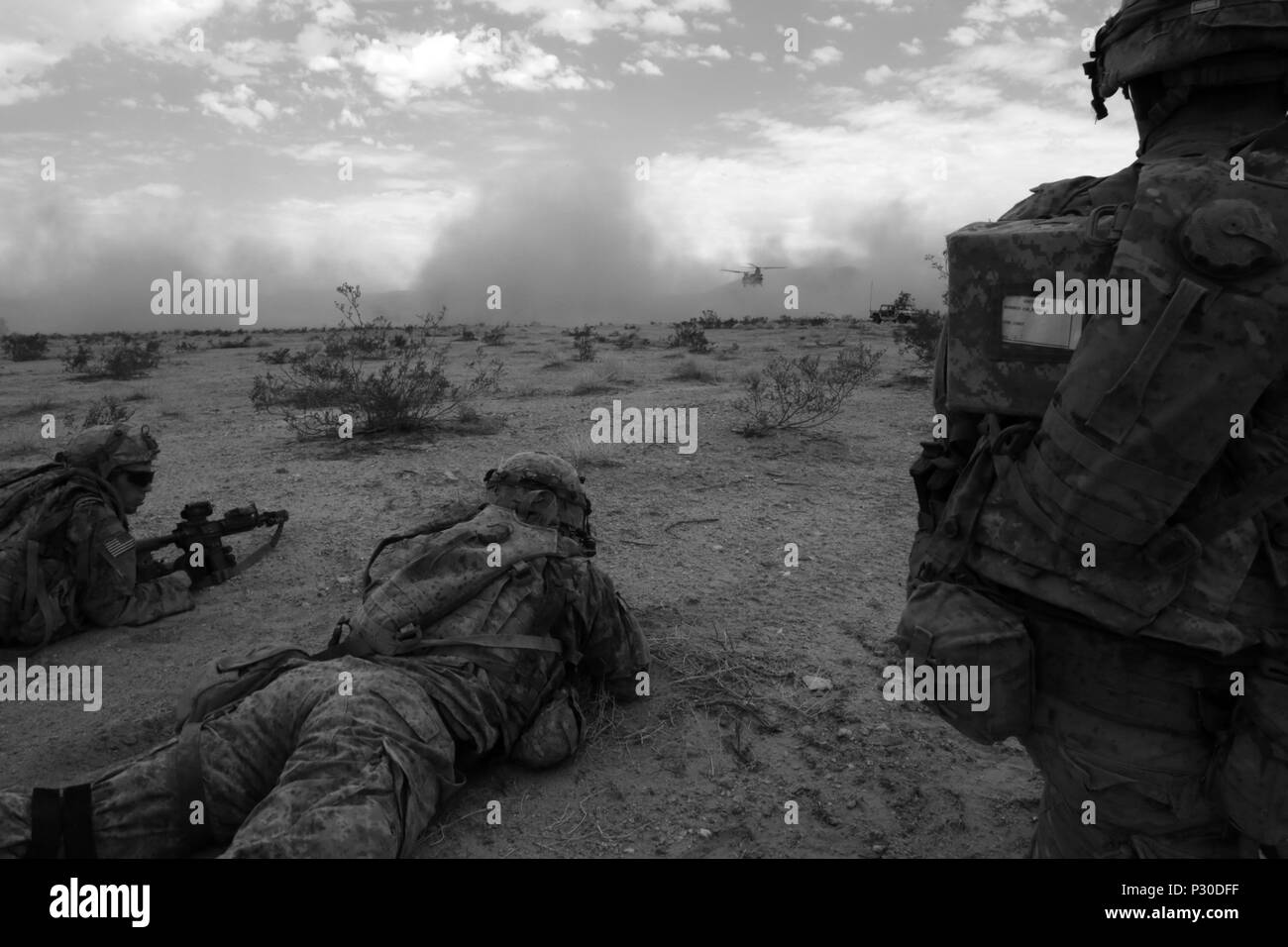 U.S. Army Soldiers from 1st Brigade Combat Team, 1st Infantry Division, prepares for an air movement during Decisive Action Rotation 16-08 at the National Training Center, Fort Irwin, Calif., August 4, 2016. Decisive Action Rotations create a realistic training environment that tests the capabilities of Brigade Combat Teams preparing them to face similarly equipped opposing forces. (U.S. Army photo by Spc. Dedrick Johnson, Operations Group, National Training Center) Stock Photo