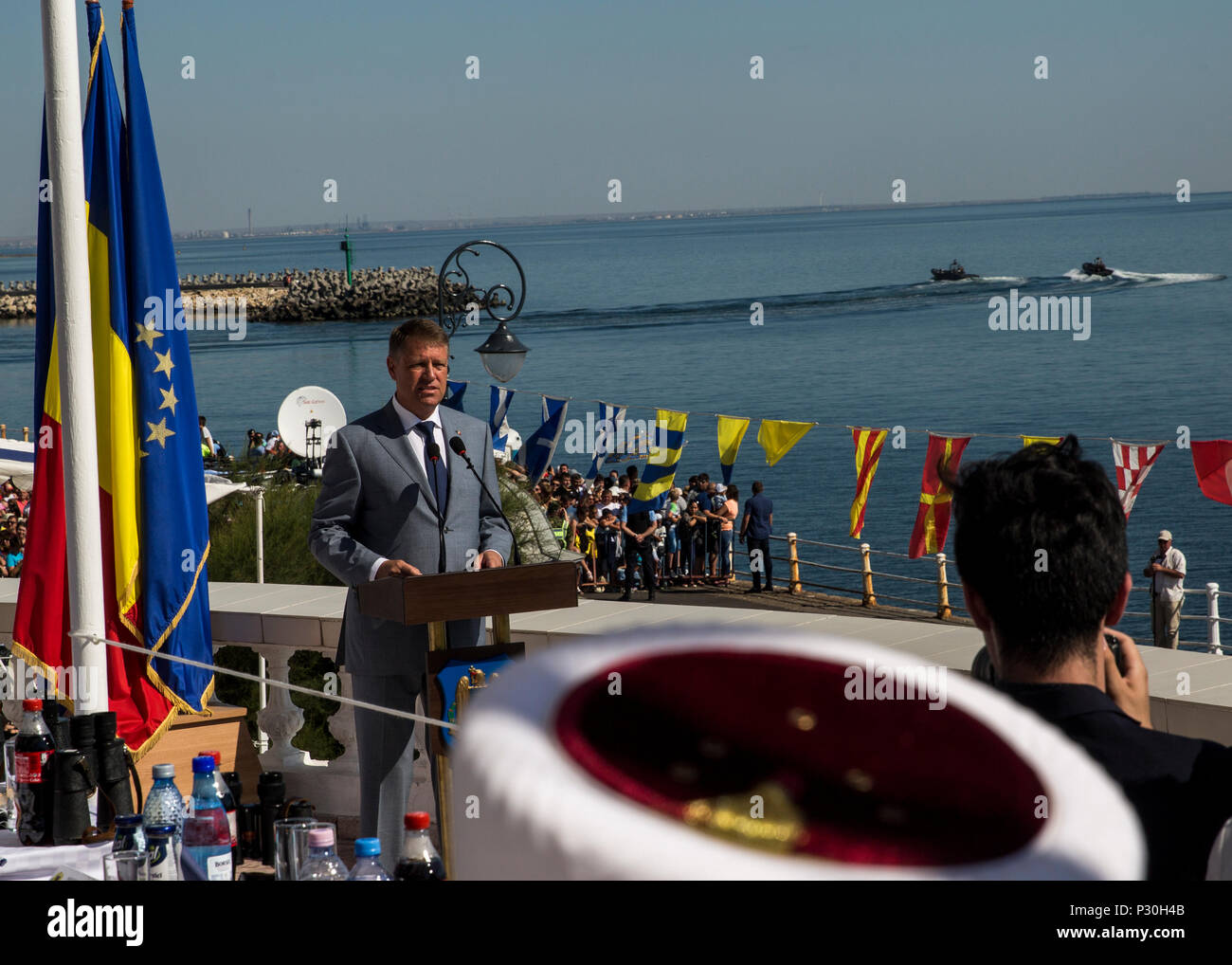 Klaus Iohannia, president of Romania, welcomes guests and U.S. Sailors and Marines supporting the Black Sea Rotational Force 16.2 to the 114th annual Navy Day celebration at the Port of Constanţa, Romania, Aug. 15, 2016. The day payed tribute to the prestigious history of the Romanian navy and highlighted the military’s movement toward new developments and modernizations. Black Sea Rotational Force is an annual multilateral security cooperation activity between the U.S. Marine Corps and partner nations in the Black Sea, Balkan and Caucasus regions designed to enhance participants’ collective p Stock Photo