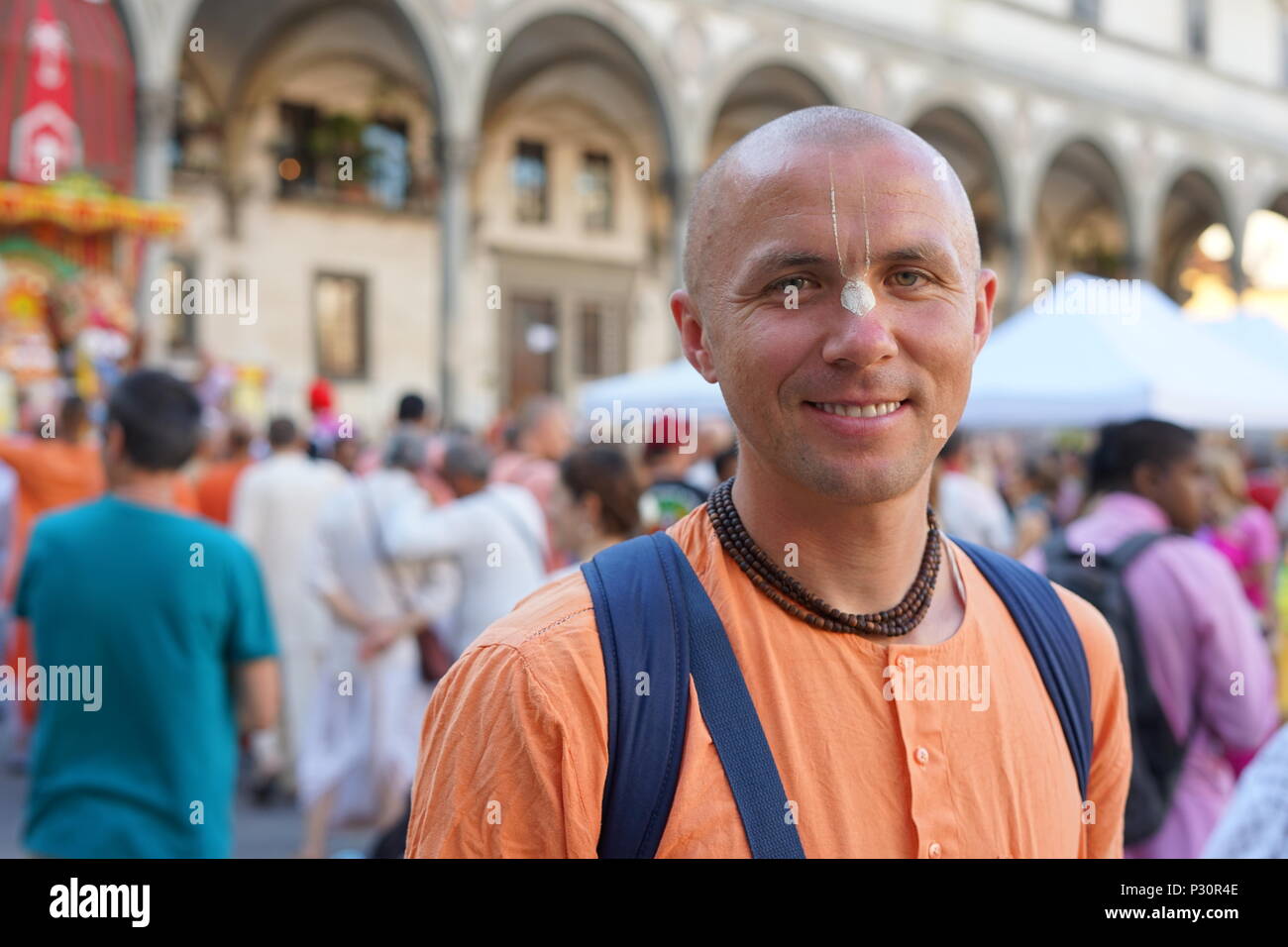 An happy Hare Krisna monk smiles with devotion and compassion Stock Photo