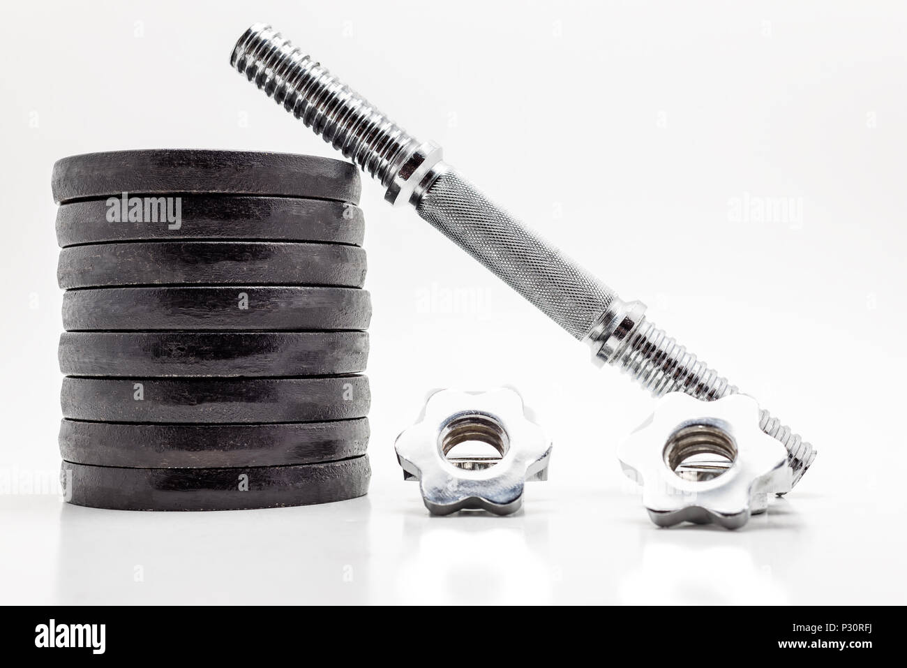 Black metal weights on white background Stock Photo Alamy