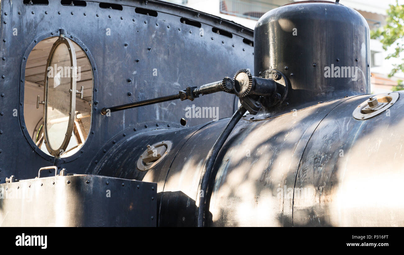 Larissa, Greece - June 11th, 2018: Detail of the top of an old locomotive made by the Krupp company in 1935 placed at Platia Ose next to the Larissa t Stock Photo