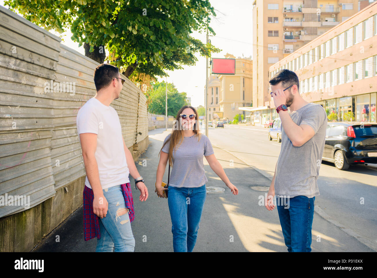 Group of friends having fun outdoors in sunny day in downtown Stock ...