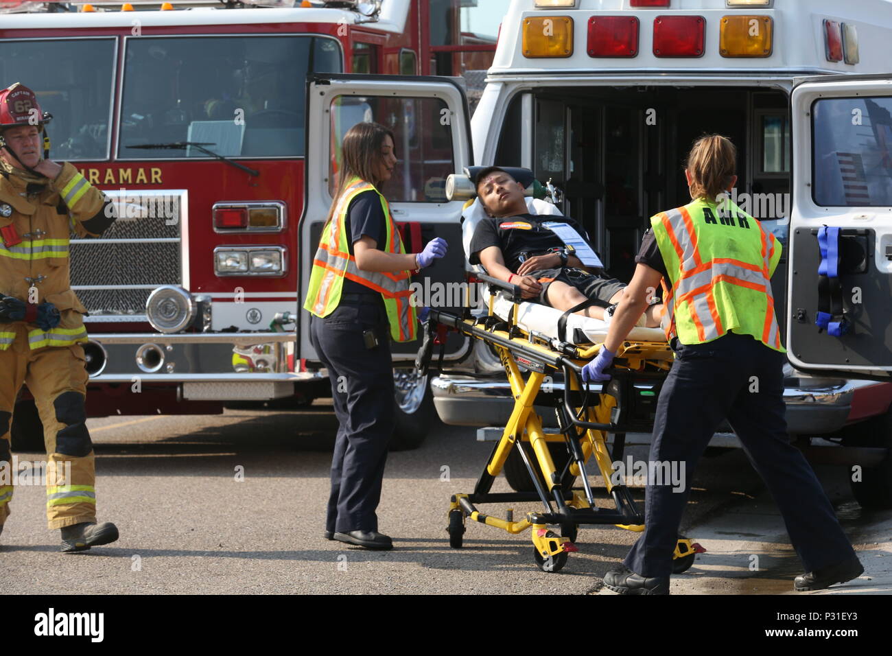 San Diego Emergency Medical Services paramedics load a simulated