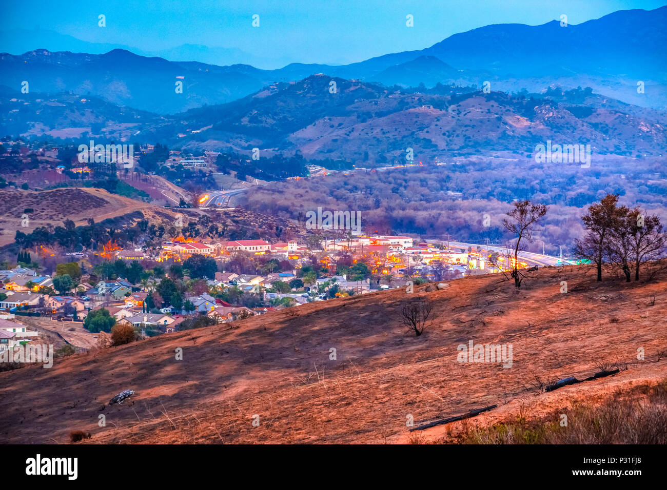 Fires in southern California, Fallbrook. Lilac fire damage on the hills next to homes. Stock Photo