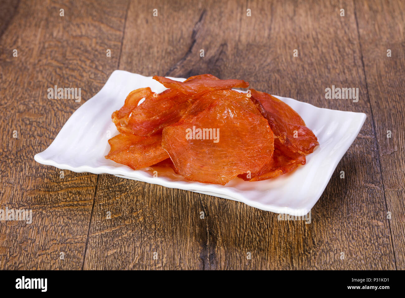 Dry chicken meat over wooden Stock Photo - Alamy