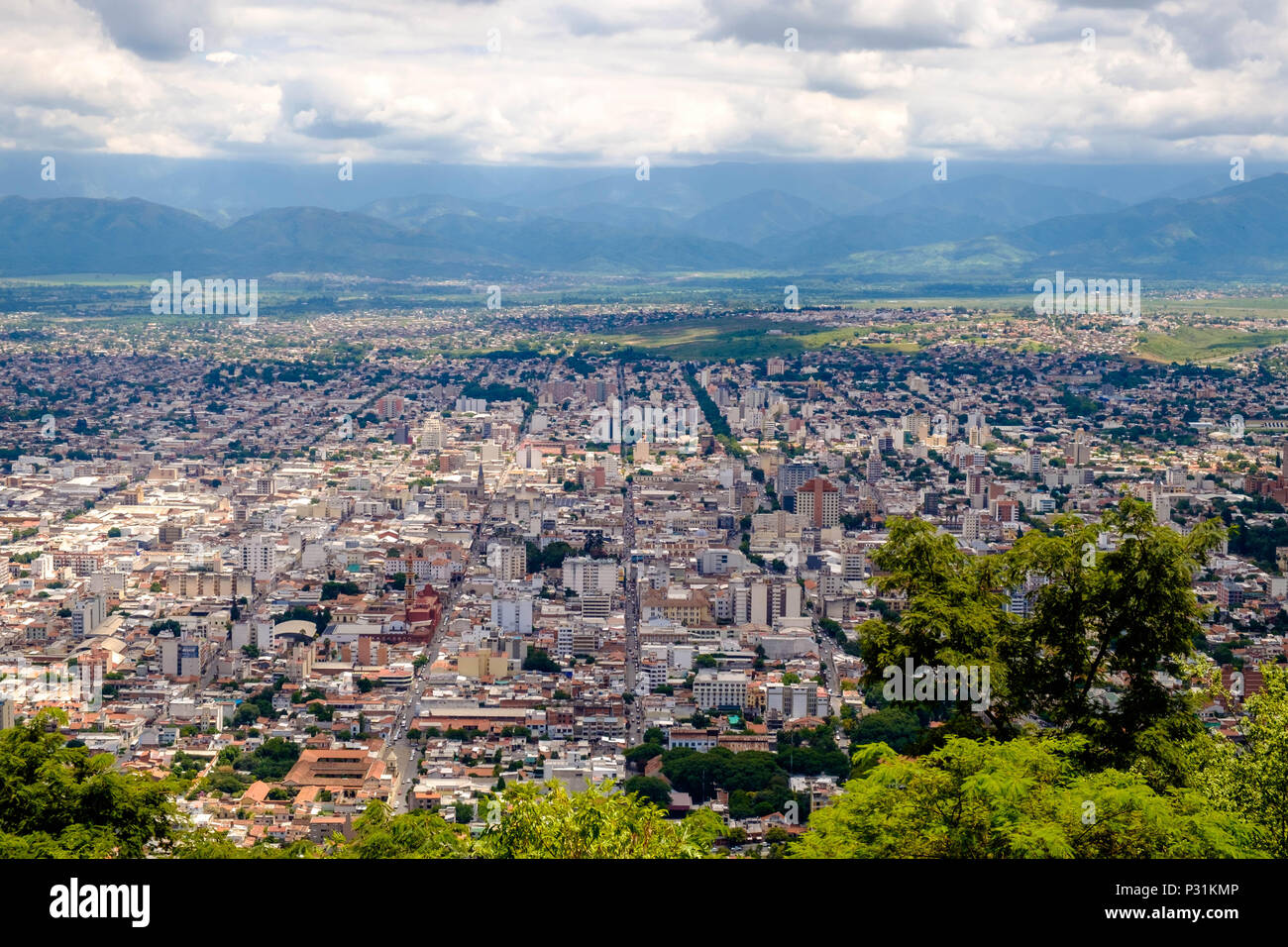 The viewpoint of Cerro San Bernardo shows the structure of Salta in Argentina. Along straight streets, buildings extend through the valley. Stock Photo