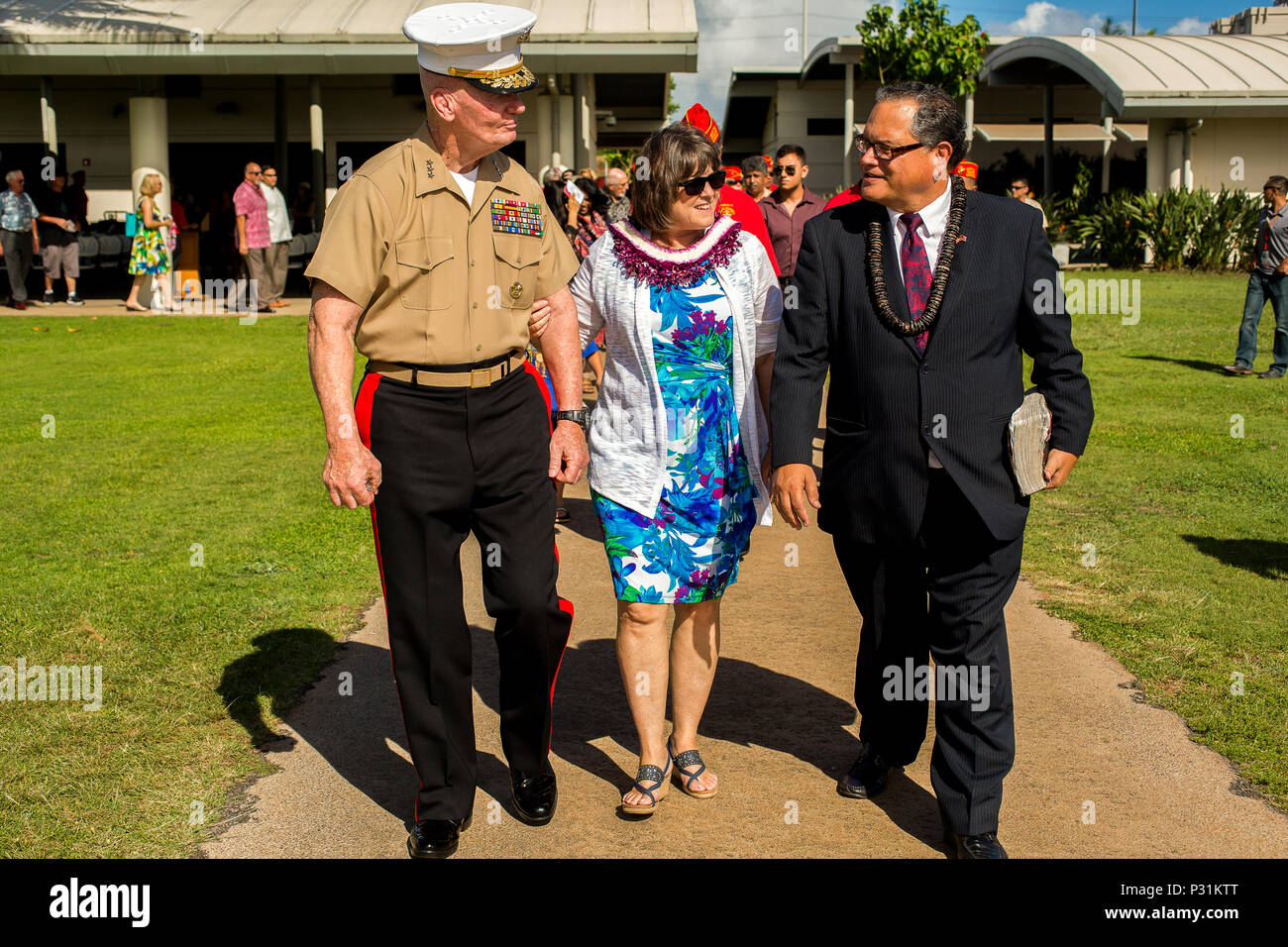 U.S. Marine Lt. Gen. John A Toolan, commander of U.S.  Marine Corps Forces, Pacific, and his wife Helen walk with Minister Kahu Kelekona Bishaw toward the memorial during the Marine Memorial Rededication Ceremony at the USS ARIZONA Education Center, Honolulu, Hawaii, Aug. 19, 2016. (U.S. Marine Corps photo by Lance Cpl. Robert Sweet) Stock Photo