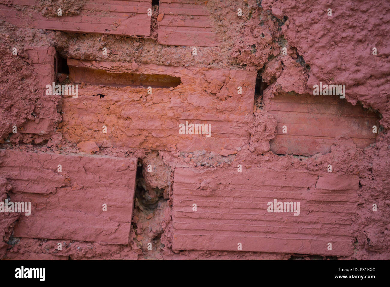 Dark orange colored brick wall. Clayish material walled construction,  building. Hardened by heat of the sun. Used for building homes,  establishments a Stock Photo - Alamy