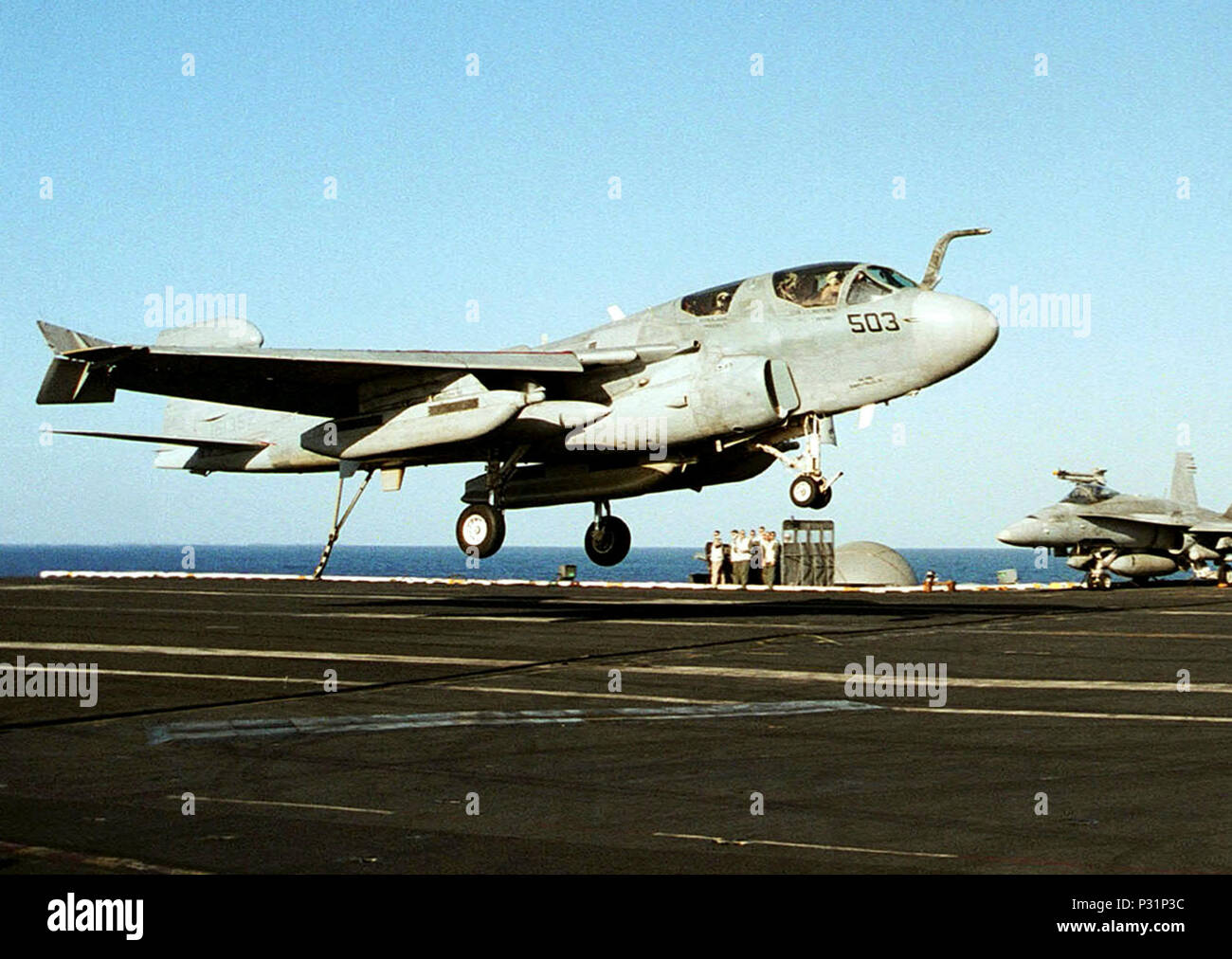 sea aboard USS Theodore Roosevelt (CVN 71) Dec. 19, 2001 -- Commander Gary 'Norm' Peterson's EA-6B Prowler jet heads for the number one arresting gear wire for his 1,000th Trap as a Naval Aviator.  Cdr. Peterson's milestone occurred aboard USS Theodore Roosevelt while deployed in support Operation Enduring Freedom.  Peterson is presently the Commanding Officer of Tactical Electronic Warfare Squadron One Three Seven (VAQ-137) which is part of Carrier Air Wing One (CVW 1) deployed with the Roosevelt. Stock Photo