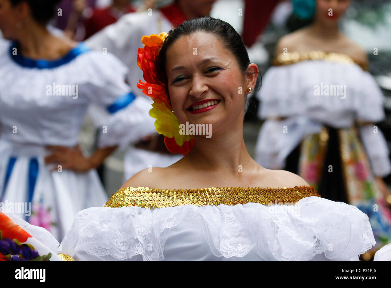 frankfurt germany 16th june 2018 a columbian woman participates in the parade wearing a traditional dress thousands of people participated and watched the 2018 parade der kulturen parade of cultures organised by the frankfurter jugendring frankfurt youth council the parade with participants from over 40 different groups of expat and cultural organisations showcased the cultural diversity of frankfurt credit michael debetspacific pressalamy live news P31PJ6