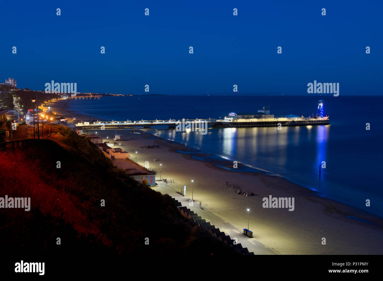 A high angle view of Bournemouth pier at night with a clear blue sky Stock Photo