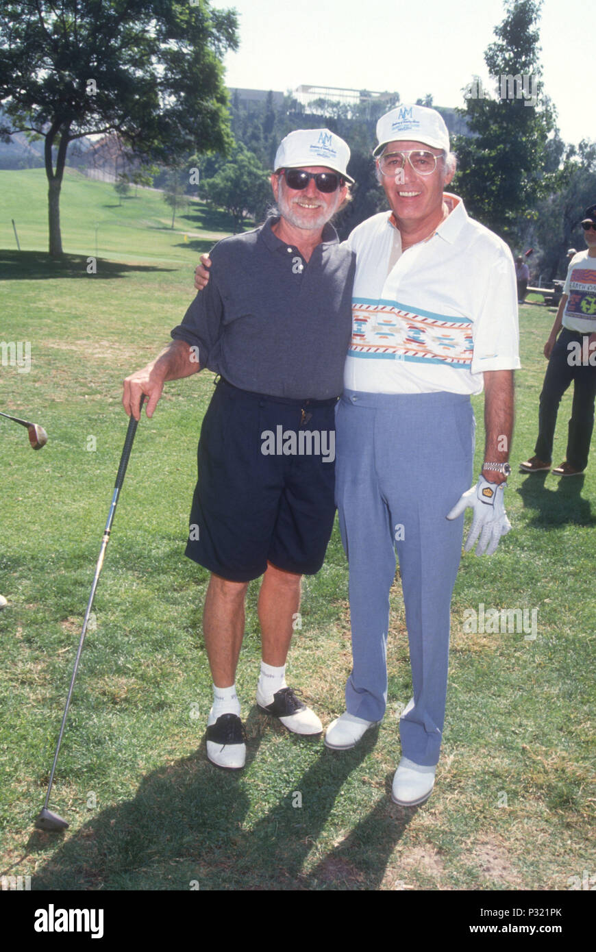 BURBANK, CA - OCTOBER 14: (L-R) Singers Willie Nelson and Carl Perkins attend Willie Nelson Golf Tournament on October 14, 1991 in Burbank, California. Photo by Barry King/Alamy Stock Photo Stock Photo