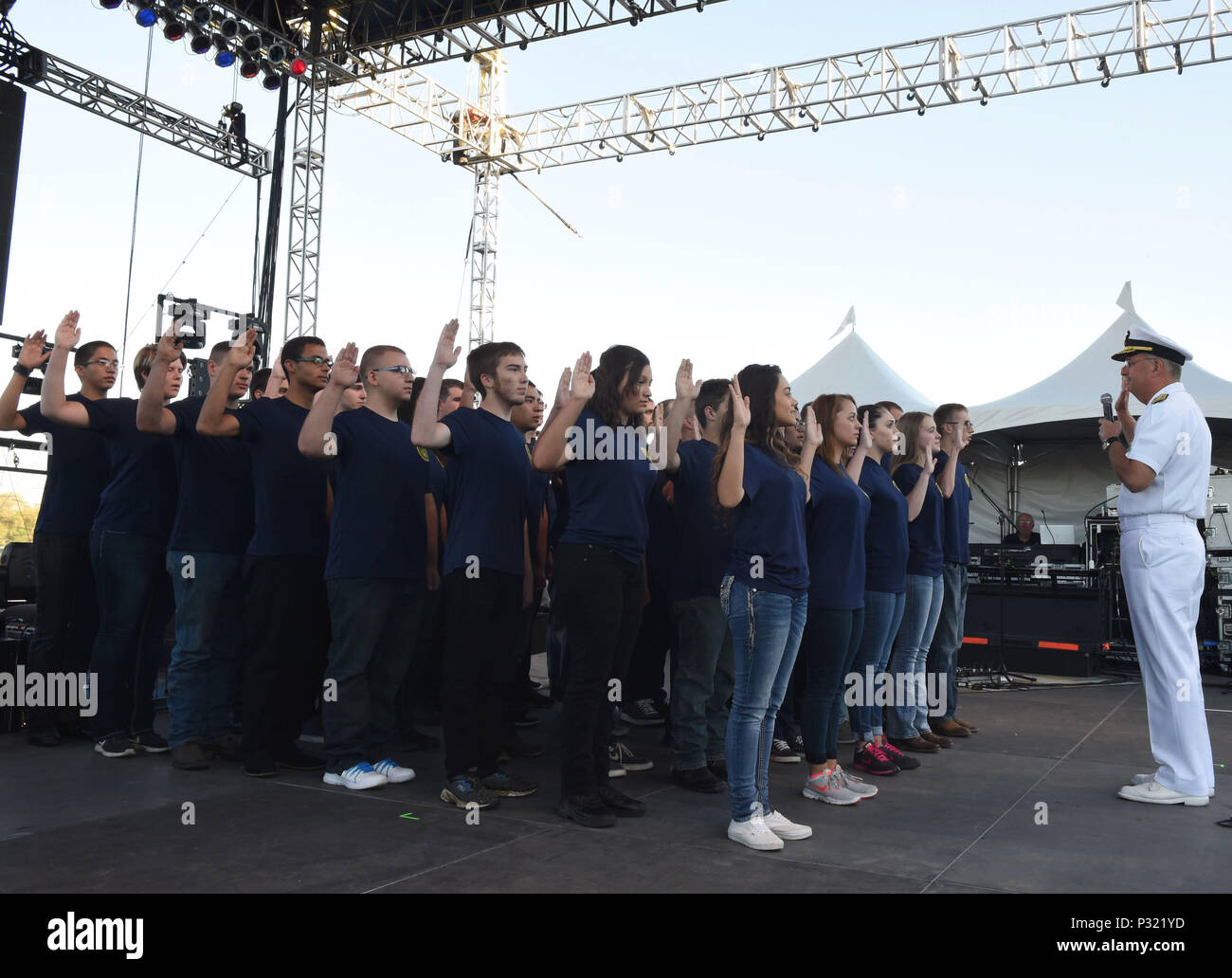 BOISE, Idaho (August 23, 2016) Rear Adm. Bruce Gillingham, Commander, Navy Medicine West administers the oath of enlistment to 40 Delayed Entry Program members from Naval Recruiting District Portland during the Western Idaho Fair as part of Boise Navy Week. Navy Weeks focus a variety of outreach assets, equipment and personnel on a single city for a weeklong series of engagements with key influencers and organizations. (US Navy Photo by Mass Communication Specialist 1st Class Marie A. Montez)Released Stock Photo