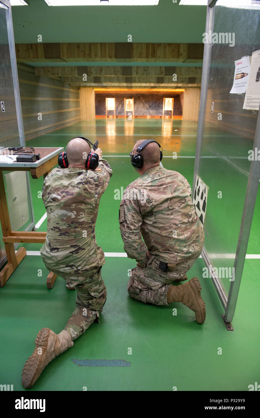 A U.S. Soldier with 650th Military Intelligence Group fires an M9