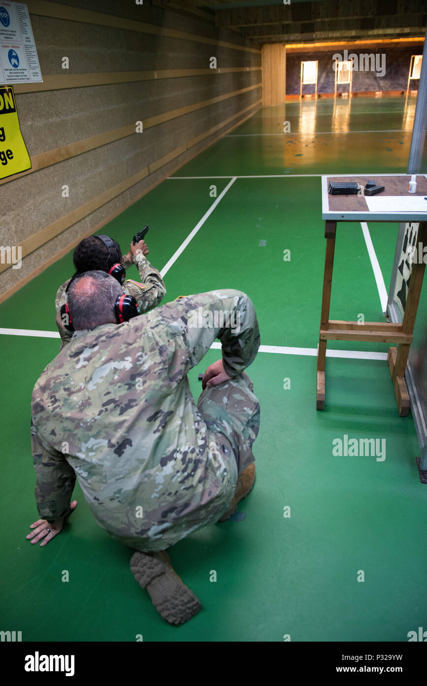 A U.S. Soldier with 650th Military Intelligence Group fires an M9
