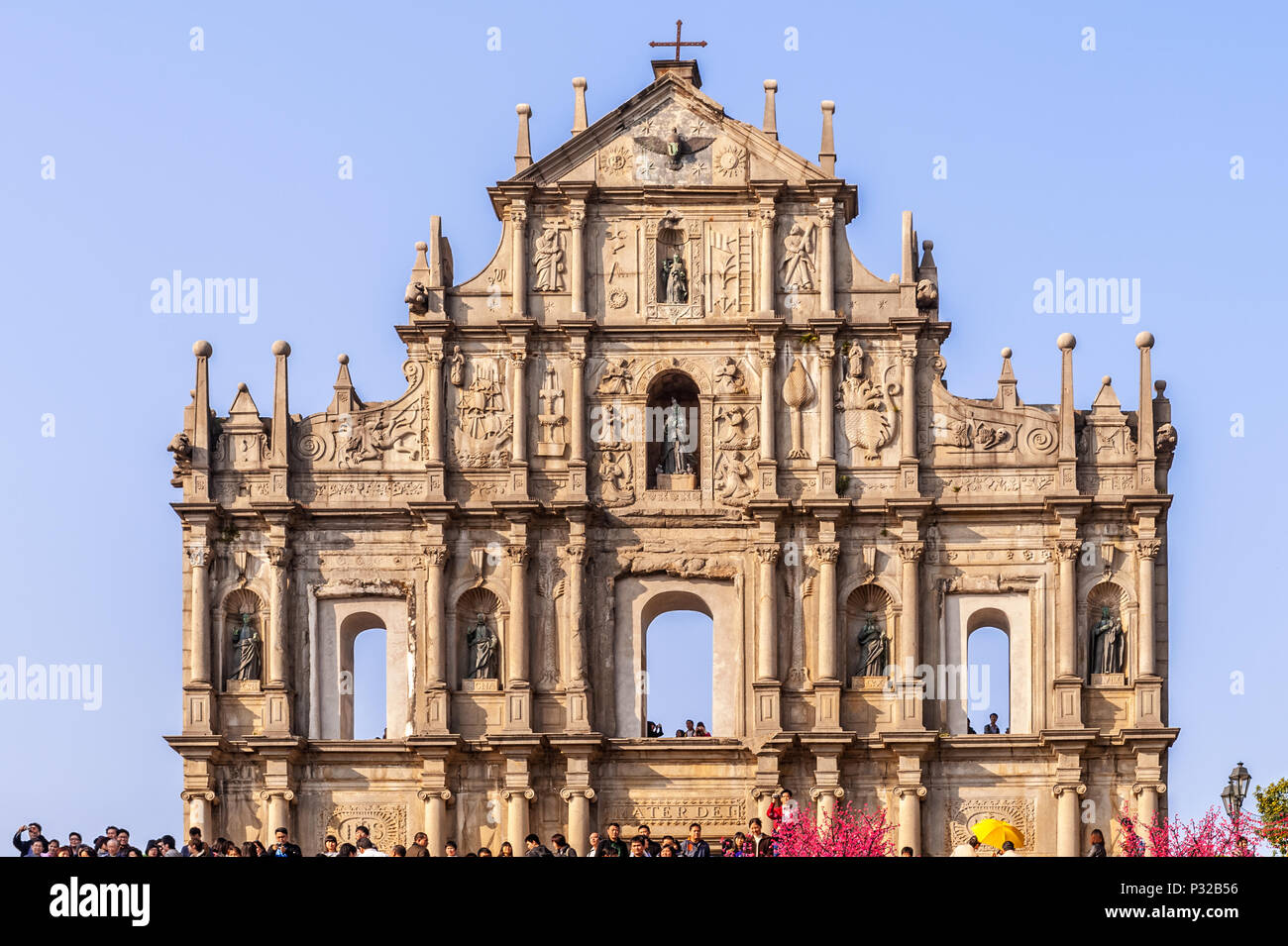 Macau, China - February 1, 2009: Tourists gather in front of facade of  the Jesuits cathedral church in Macau Stock Photo