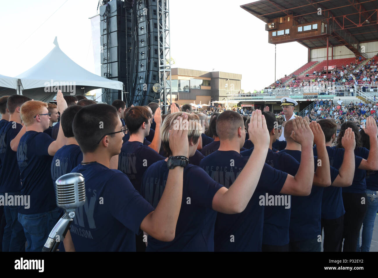 BOISE, Idaho (August 23, 2016) Rear Adm. Bruce Gillingham, Commander, Navy Medicine West administers the oath of enlistment to 40 Delayed Entry Program members from Naval Recruiting District Portland during the Western Idaho Fair as part of Boise Navy Week. Navy Weeks focus a variety of outreach assets, equipment and personnel on a single city for a weeklong series of engagements with key influencers andorganizations. (US Navy Photo by Mass Communication Specialist 1stClass Marie A. Montez) Released Stock Photo
