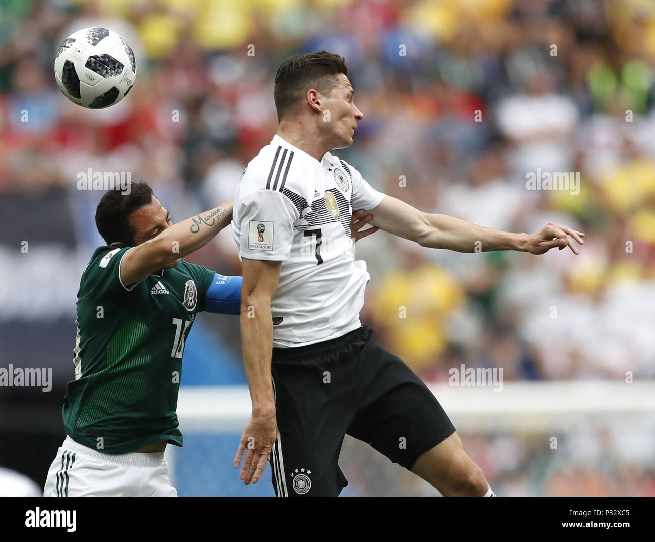 Moscow, Russia. 17th June, 2018. Julian Draxler (R) of Germany vies with Andres Guardado of Mexico during a group F match between Germany and Mexico at the 2018 FIFA World Cup in Moscow, Russia, June 17, 2018. Credit: Cao Can/Xinhua/Alamy Live News Stock Photo