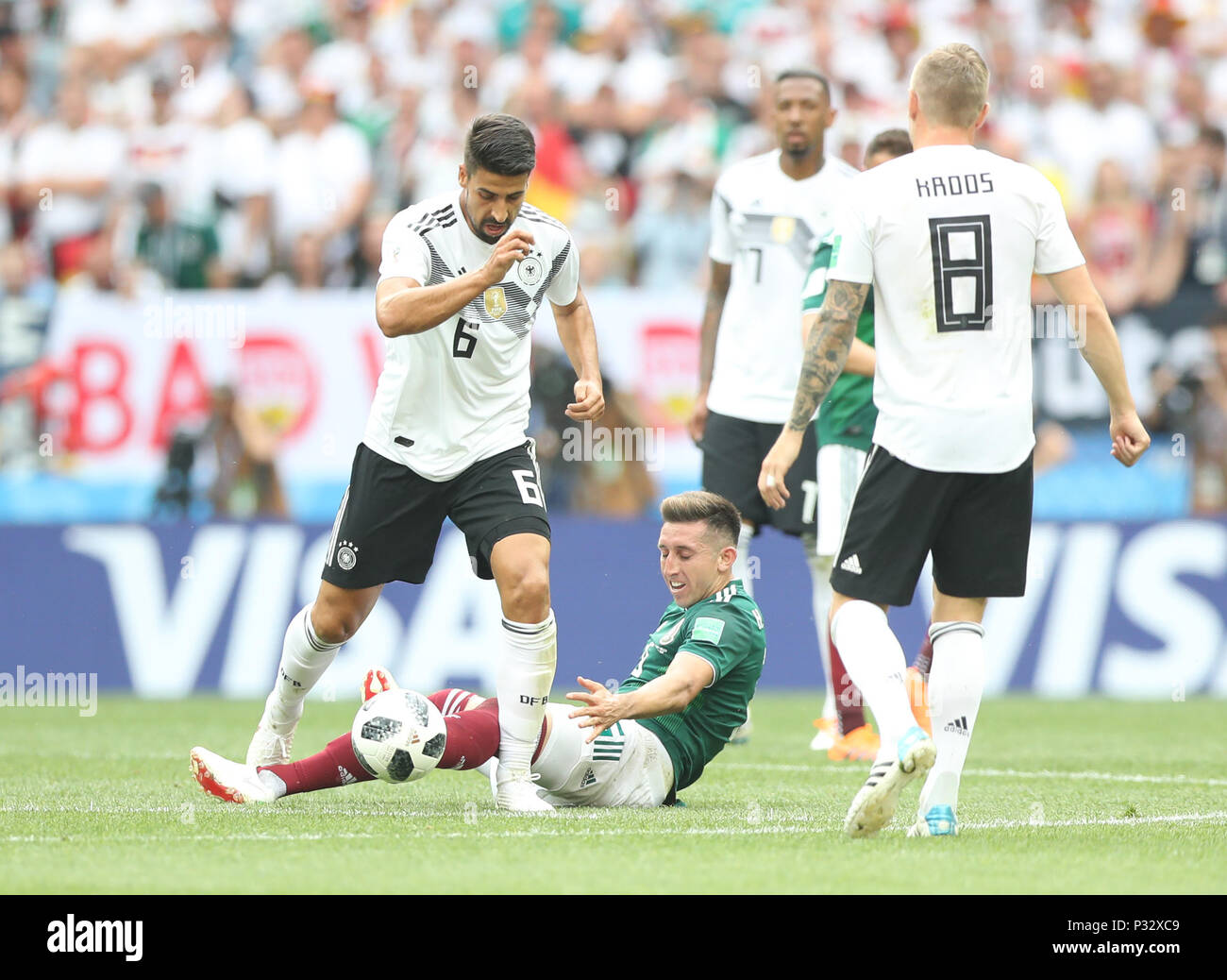 Moscow, Russia. 17th June, 2018. Sami Khedira (1st L) of Germany vies with Hector Herrera (bottom) of Mexico during a group F match between Germany and Mexico at the 2018 FIFA World Cup in Moscow, Russia, June 17, 2018. Credit: Xu Zijian/Xinhua/Alamy Live News Stock Photo
