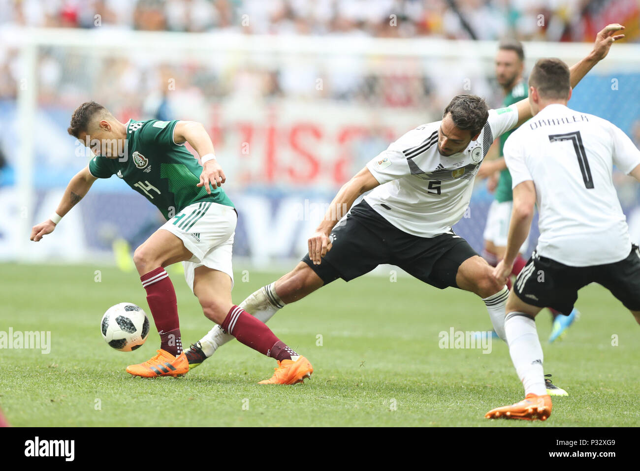 Moscow, Russia. 17th June, 2018. Mats Hummels (C) of Germany vies with Javier Hernandez (L) of Mexico during a group F match between Germany and Mexico at the 2018 FIFA World Cup in Moscow, Russia, June 17, 2018. Credit: Xu Zijian/Xinhua/Alamy Live News Stock Photo