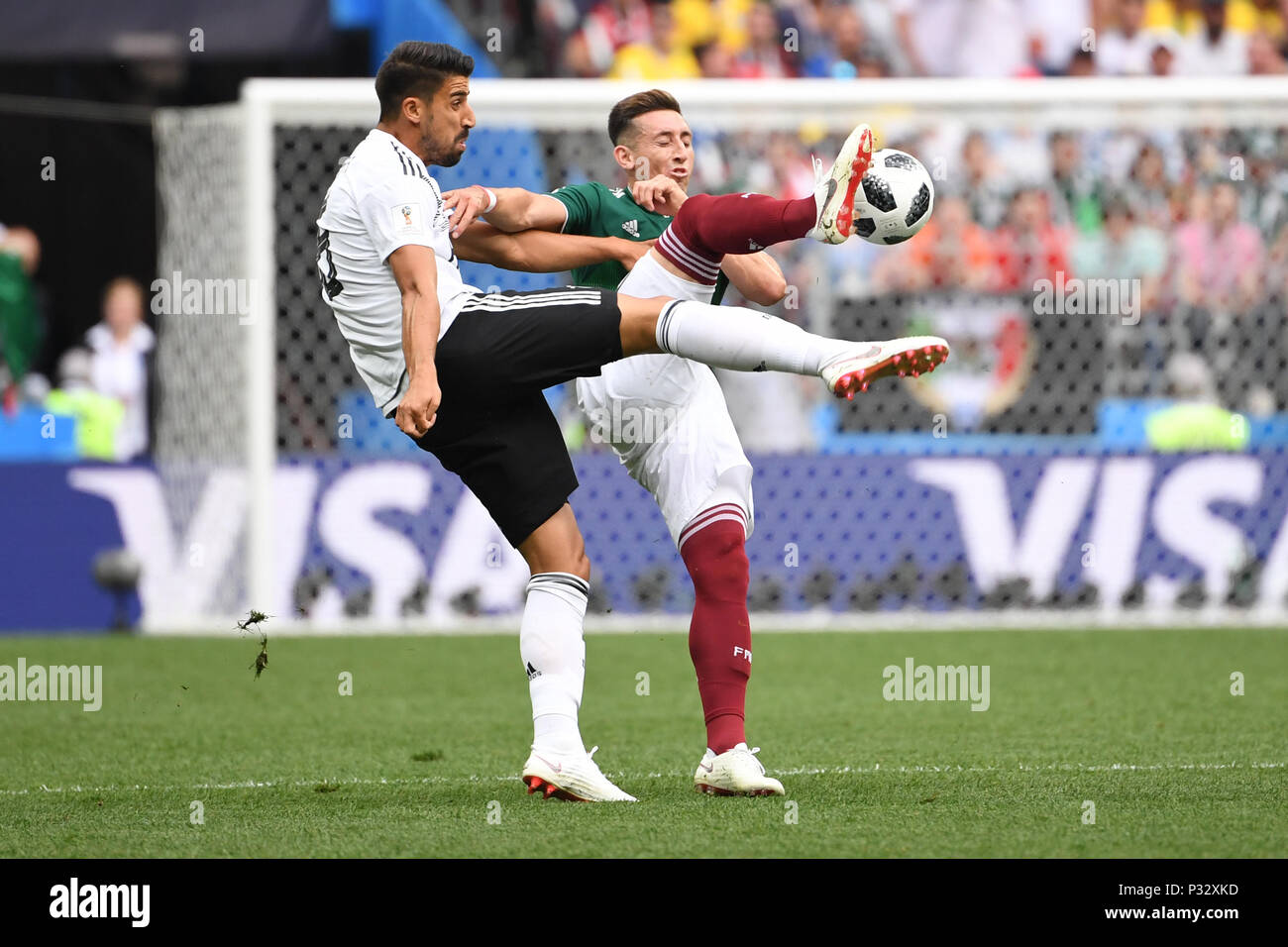 Moscow, Russia. 17th June, 2018. Sami Khedira (Germany, l.) Versus Hector Herrera (Mexico, r.). GES/Football/World Cup 2018 Russia: Germany - Mexico, 17.06.2018 GES/Soccer/Football/Worldcup 2018 Russia: Germany vs Mexico, Moscow, June 17, 2018 | usage worldwide Credit: dpa/Alamy Live News Stock Photo