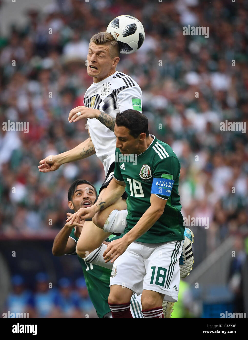 Moscow, Russia. 17th June, 2018. Carlos Vela (Mexico), Toni Kroos (Germany), Andres Guardado (Mexico). GES/Football/World Cup 2018 Russia: Germany - Mexico, 17.06.2018 GES/Soccer/Football/Worldcup 2018 Russia: Germany vs Mexico, Moscow, June 17, 2018 | usage worldwide Credit: dpa/Alamy Live News Stock Photo