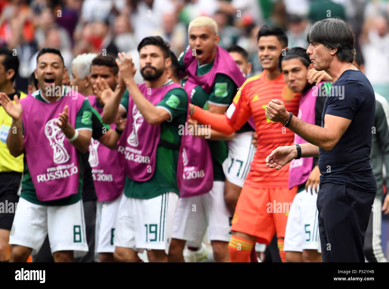 Moscow, Russia, 17 June 2018, , Soccer, FIFA World Cup, Group F, Matchday 1 of 3, Germany vs Mexico at the Luzhniki Stadium: Germany's coach Joachim Loew reacts beside players Marco Fabian (L) of Mexico, Oribe Peralta (3-L) of Mexico, who are celebrating the 0-1 goal. Photo: Federico Gambarini/dpa Credit: dpa picture alliance/Alamy Live News Credit: dpa picture alliance/Alamy Live News Stock Photo