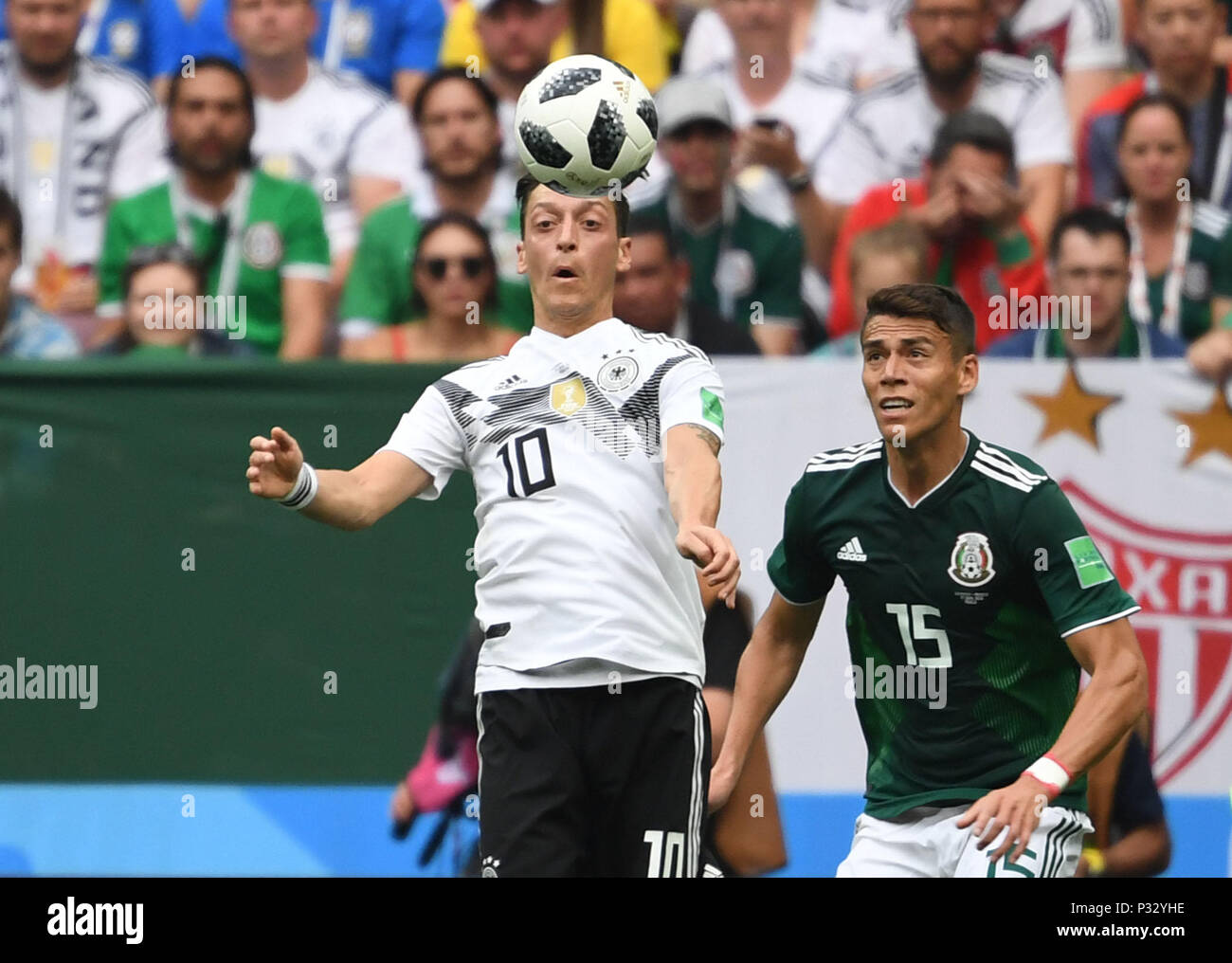 Moscow, Russia, 17 June 2018, , Soccer, FIFA World Cup, Group F, Matchday 1 of 3, Germany vs Mexico at the Luzhniki Stadium: Mesut Ozil of Germany and Hector Moreno (R) aus Mexico vie for the ball. Photo: Federico Gambarini/dpa Credit: dpa picture alliance/Alamy Live News Credit: dpa picture alliance/Alamy Live News Stock Photo