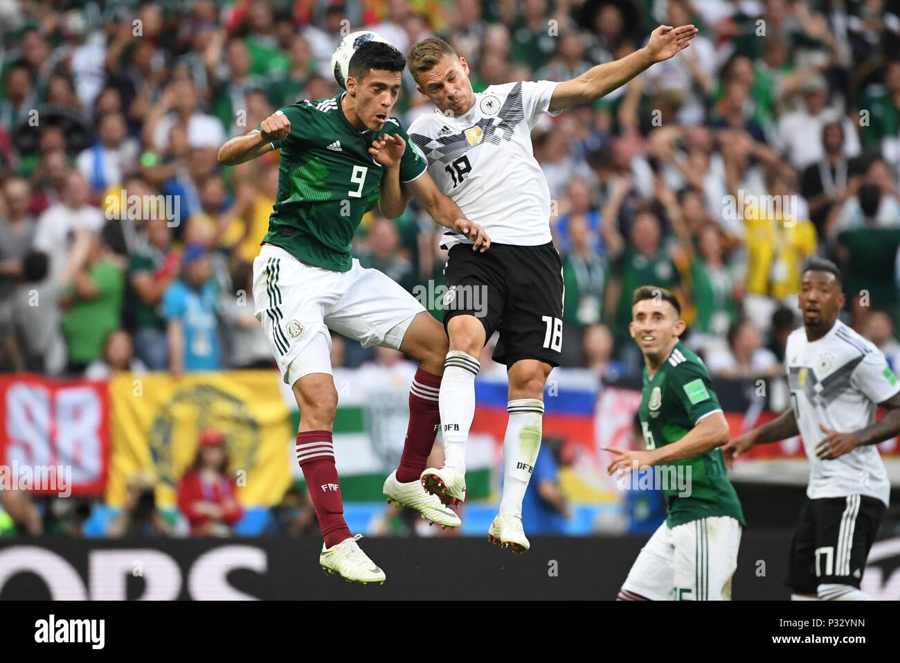 Moscow, Russia. 17th June, 2018. Raul Jimenez (Mexico, l.) Versus Joshua Kimmich (Germany, r.). GES/Football/World Cup 2018 Russia: Germany - Mexico, 17.06.2018 GES/Soccer/Football/Worldcup 2018 Russia: Germany vs Mexico, Moscow, June 17, 2018 | usage worldwide Credit: dpa/Alamy Live News Stock Photo