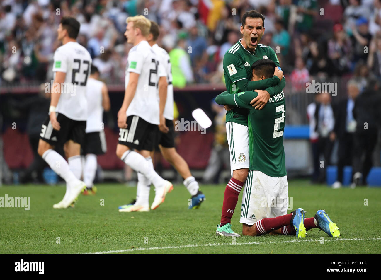 Moscow, Russia. 17th June, 2018. jubilation at the Mexicans after the game: Rafael Marquez (Mexico) with Hugo Ayala (Mexico). Behind it German player is disappointed. GES/Football/World Cup 2018 Russia: Germany - Mexico, 17.06.2018 GES/Soccer/Football/Worldcup 2018 Russia: Germany vs Mexico, Moscow, June 17, 2018 | usage worldwide Credit: dpa/Alamy Live News Stock Photo