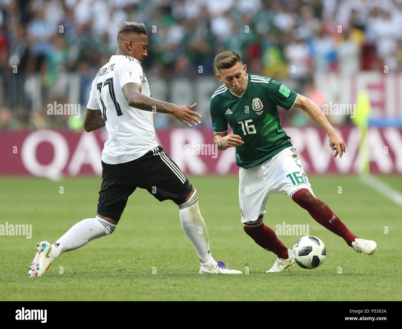 Moscow, Russia. 17th June, 2018. Jerome Boateng (L) of Germany vies with Hector Herrera of Mexico during a group F match between Germany and Mexico at the 2018 FIFA World Cup in Moscow, Russia, June 17, 2018. Credit: Xu Zijian/Xinhua/Alamy Live News Stock Photo