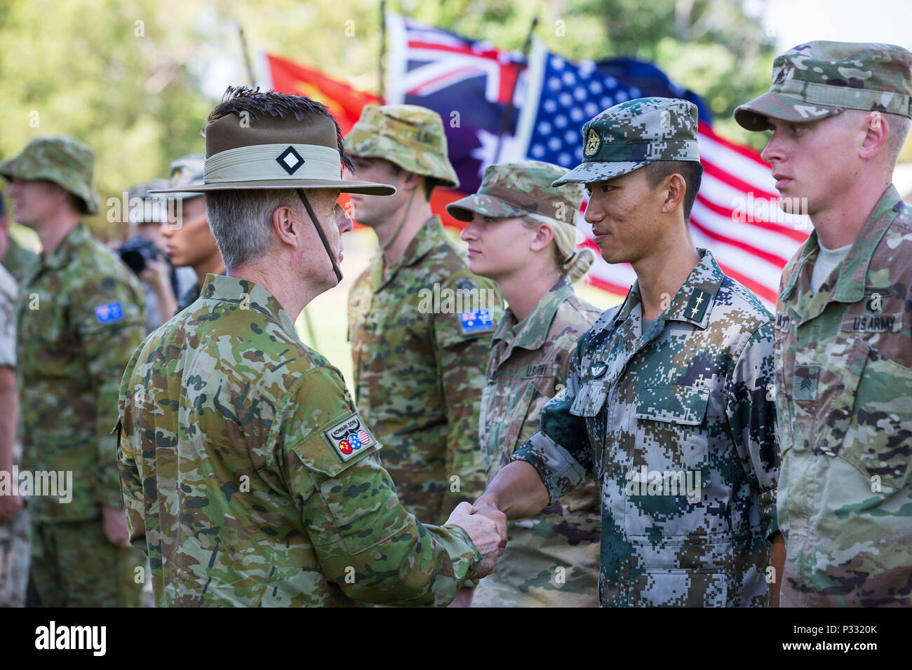 Australian Army officer Brigadier Cantwell, AM, Deputy Commander 2nd Division, shakes hands with a soldier from Chinese People's Liberation Army during the Exercise Kowari opening ceremony at Larrakeyah Barracks in