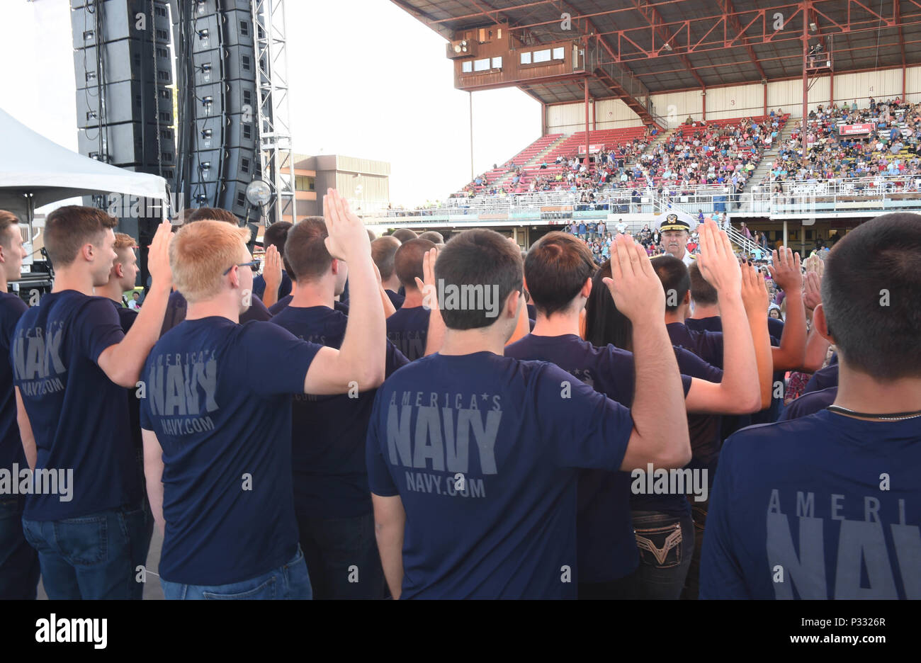 160823-N-CM227-134 BOISE, Idaho (Aug. 23, 2016) Rear Adm. Bruce Gillingham, Commander, Navy Medicine West administers the oath of enlistment to 40 Delayed Entry Program members from Naval Recruiting District Portland during the Western Idaho Fair as part of Boise Navy Week. Navy Weeks focus a variety of outreach assets, equipment and personnel on a single city for a weeklong series of engagements with key influencers andorganizations. (U.S. Navy Photo by Mass Communication Specialist 1stClass Marie A. Montez/Released) Stock Photo