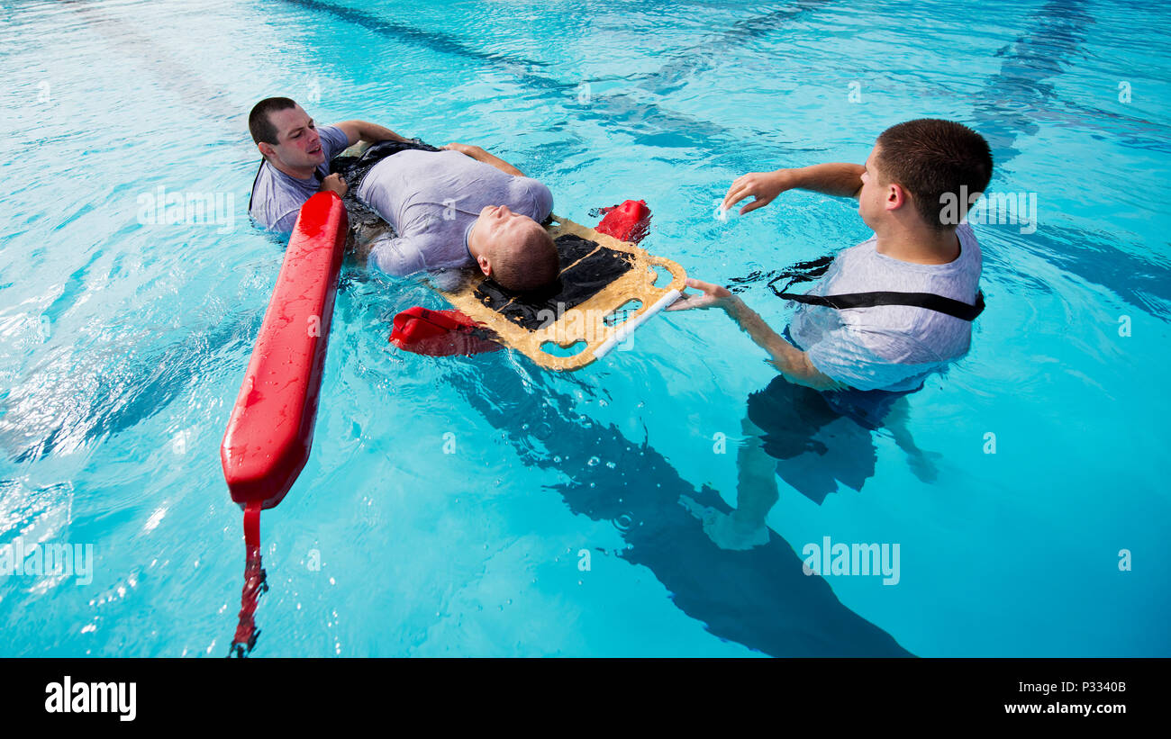 https://c8.alamy.com/comp/P3340B/airmen-from-the-5th-medical-operations-squadron-move-a-simulated-patient-during-training-at-the-base-pool-at-minot-air-force-base-nd-aug-10-2016-a-water-rescue-board-is-used-in-conjunction-with-lifeguard-buoys-to-keep-the-patient-above-water-during-the-rescue-us-air-force-photoairman-1st-class-jt-armstrong-P3340B.jpg