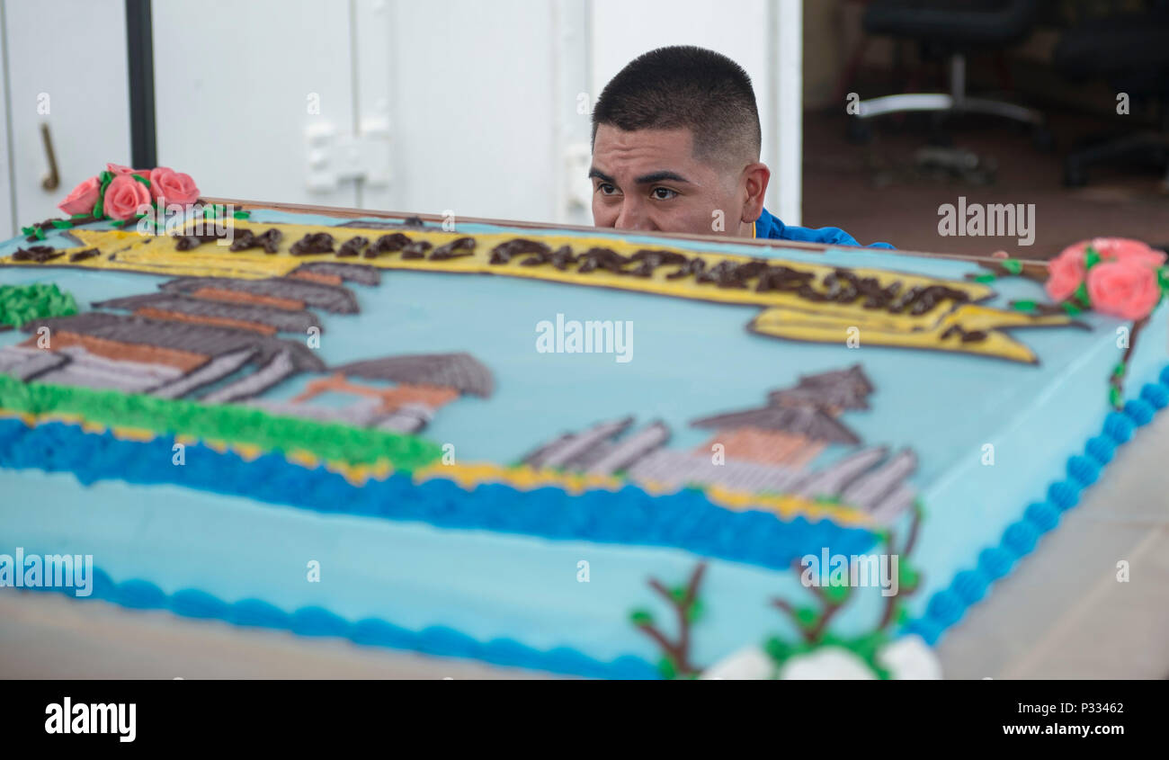 U.S. Navy Hospital Corpsman 3rd Class Santiago Ortiz checks the level on a cake during a Pacific Partnership 2016 reception aboard hospital ship USNS Mercy (T-AH 19) Padang, Indonesia, Aug. 27, 2016. Pacific Partnership is an annual deployment of forces designed to strengthen maritime and humanitarian partnerships during disaster relief operations, while providing humanitarian, medical, dental and engineering assistance to nations of the Pacific. (U.S. Navy photo by Mass Communication Specialist 1st Class Elizabeth Merriam) Stock Photo