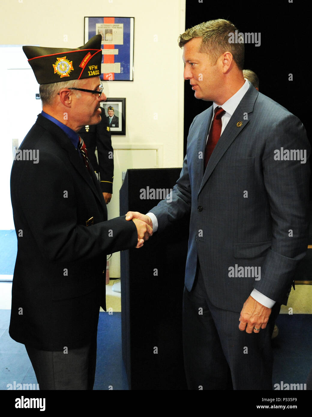 Under Secretary of the Army Patrick Murphy shakes hands with a member