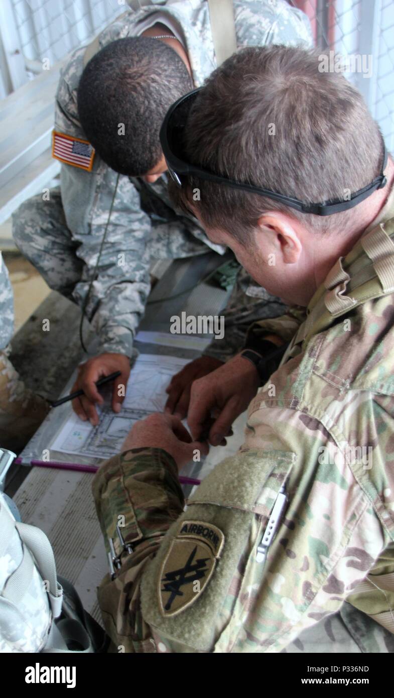 Spc. Shabaz Sharif (back with protractor) and Capt. David Oneil, both ...