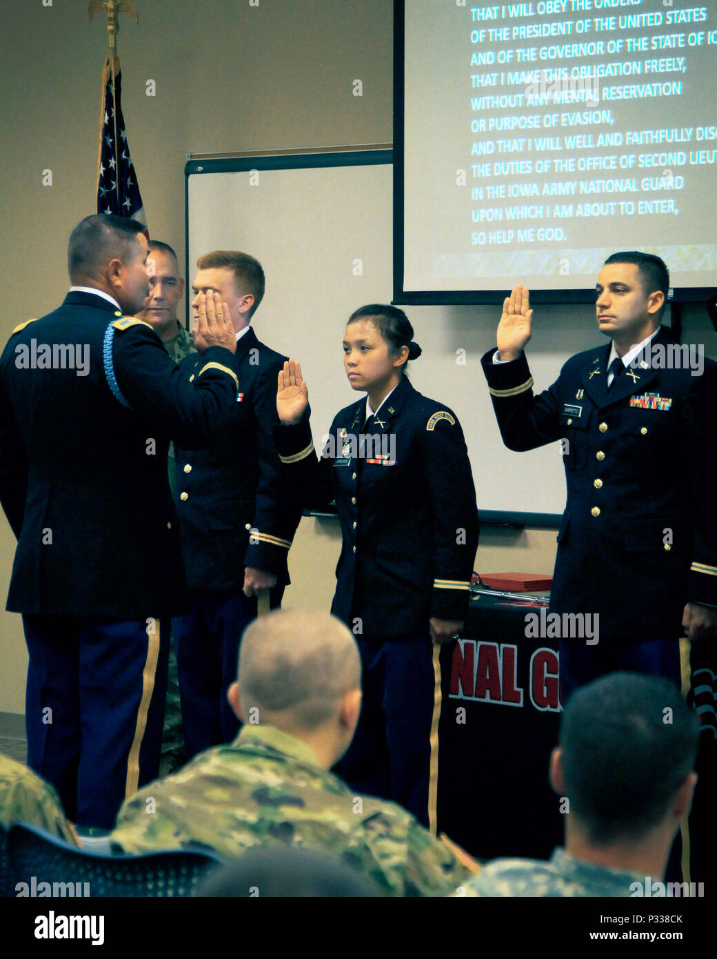 Iowa Army National Guard 2nd Lt. Trang (center), Headquarters and Headquarters Company