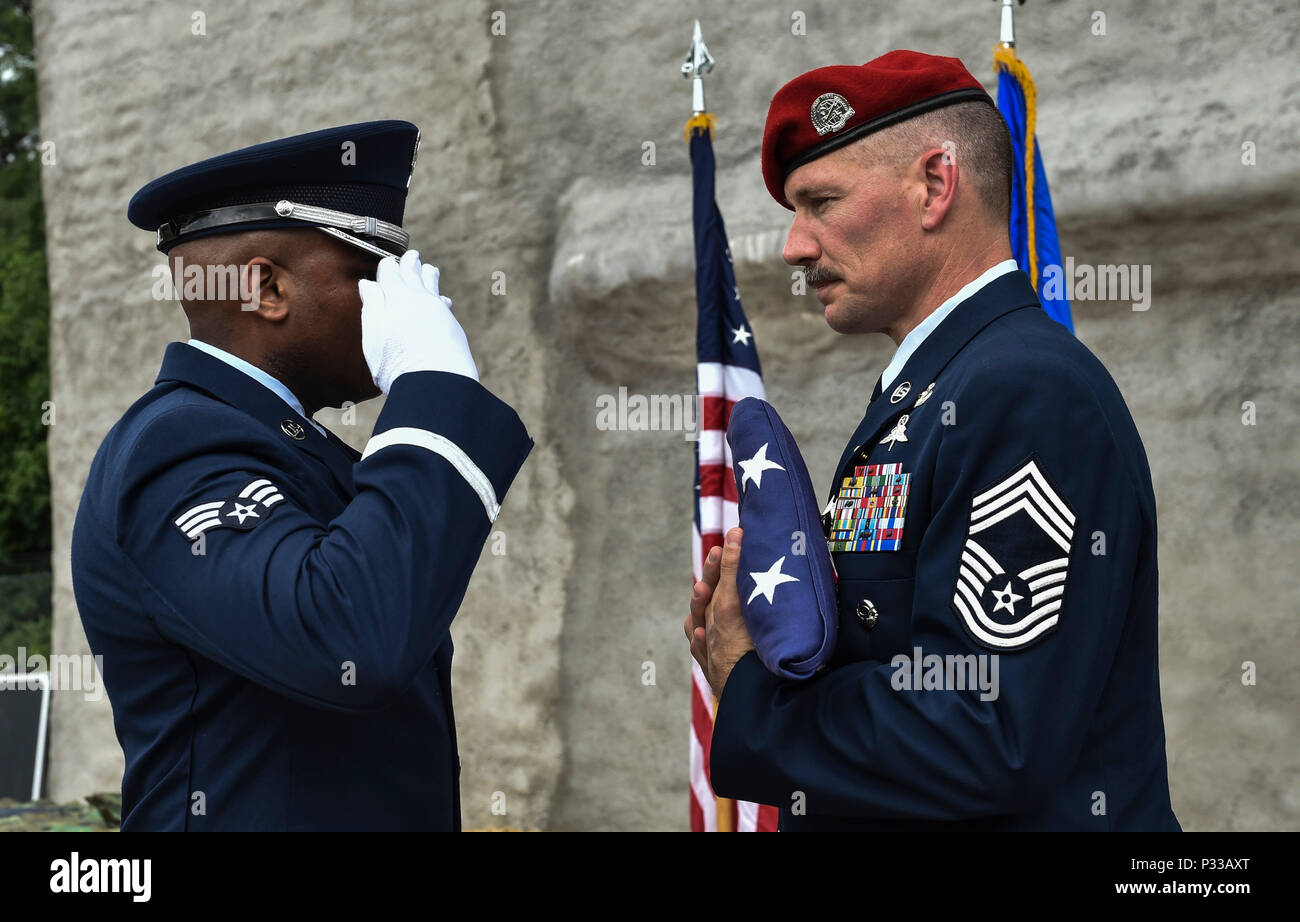 The Pope Army Airfield Honor Guard salutes the American flag during a  retirement ceremony at the Combat Control School in North Carolina. The  event marks the retirement of a Headquarters Air Force