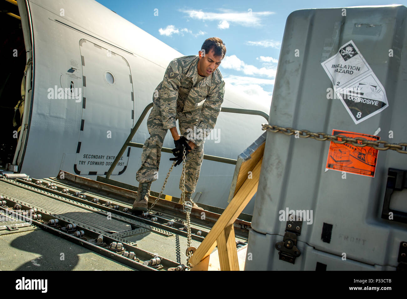 Then Tech. Sgt. Alfred Van Gieson, now Master Sgt., 48th Aerial Port  Squadron, 624th Regional Support Group, Joint Base Pearl Harbor-Hickam,  secures cargo from a C-135, Oahu, Hawaii, Aug 13, 2016. Van