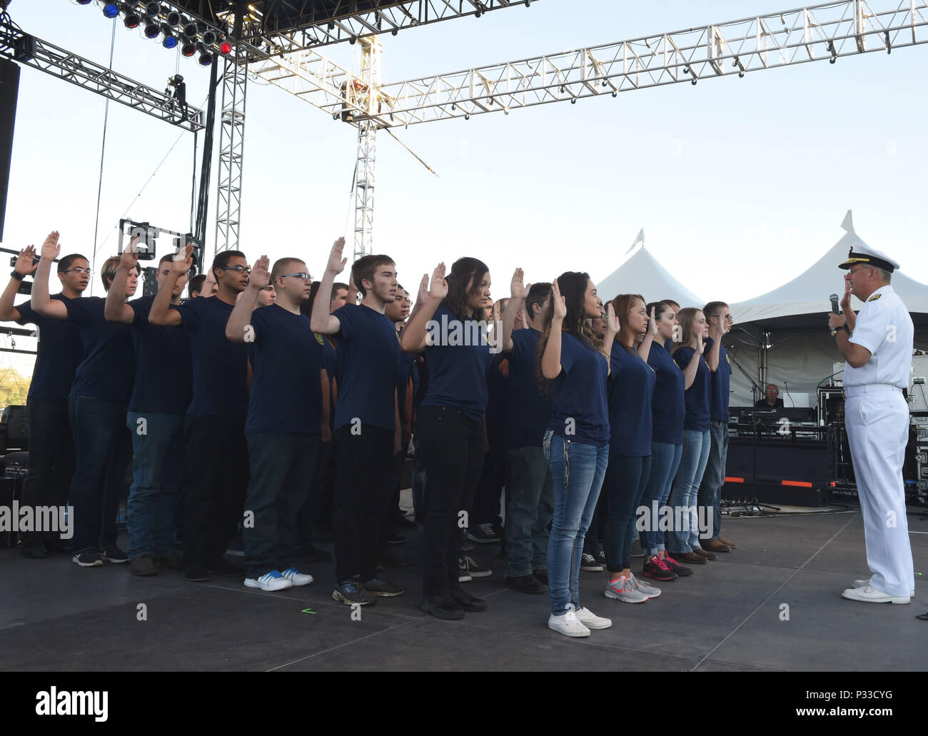 BOISE, Idaho (August 23, 2016) Rear Adm. Bruce Gillingham, Commander, Navy Medicine West administers the oath of enlistment to 40 Delayed Entry Program members from Naval Recruiting District Portland during the Western Idaho Fair as part of Boise Navy Week. Navy Weeks focus a variety of outreach assets, equipment and personnel on a single city for a weeklong series of engagements with key influencers and organizations. (US Navy Photo by Mass Communication Specialist 1st Class Marie A. Montez) Stock Photo